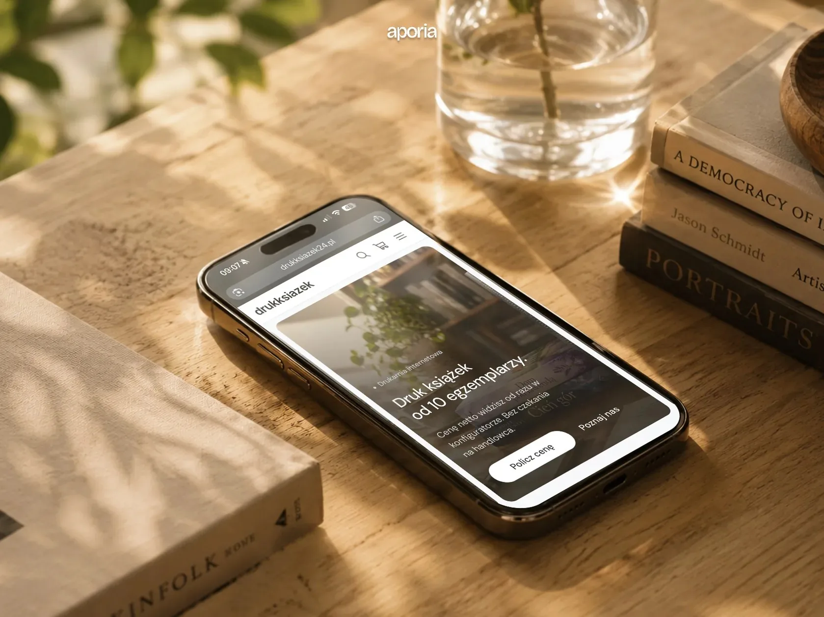 A phone on a wooden table showing the store's home page