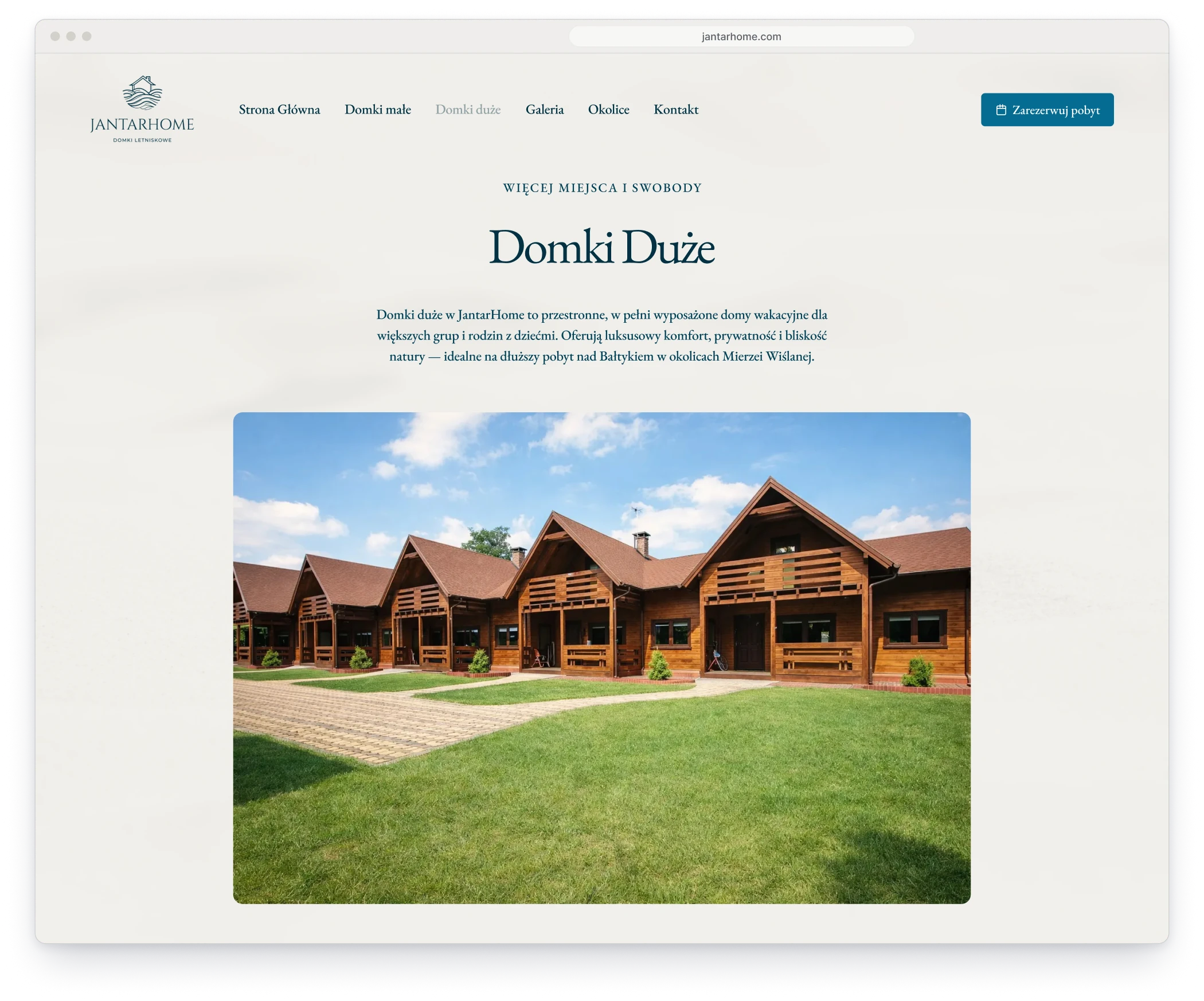 The page of the large cottages in a browser window, with the heading, a short description and a photograph of a row of larger wooden houses across a lawn