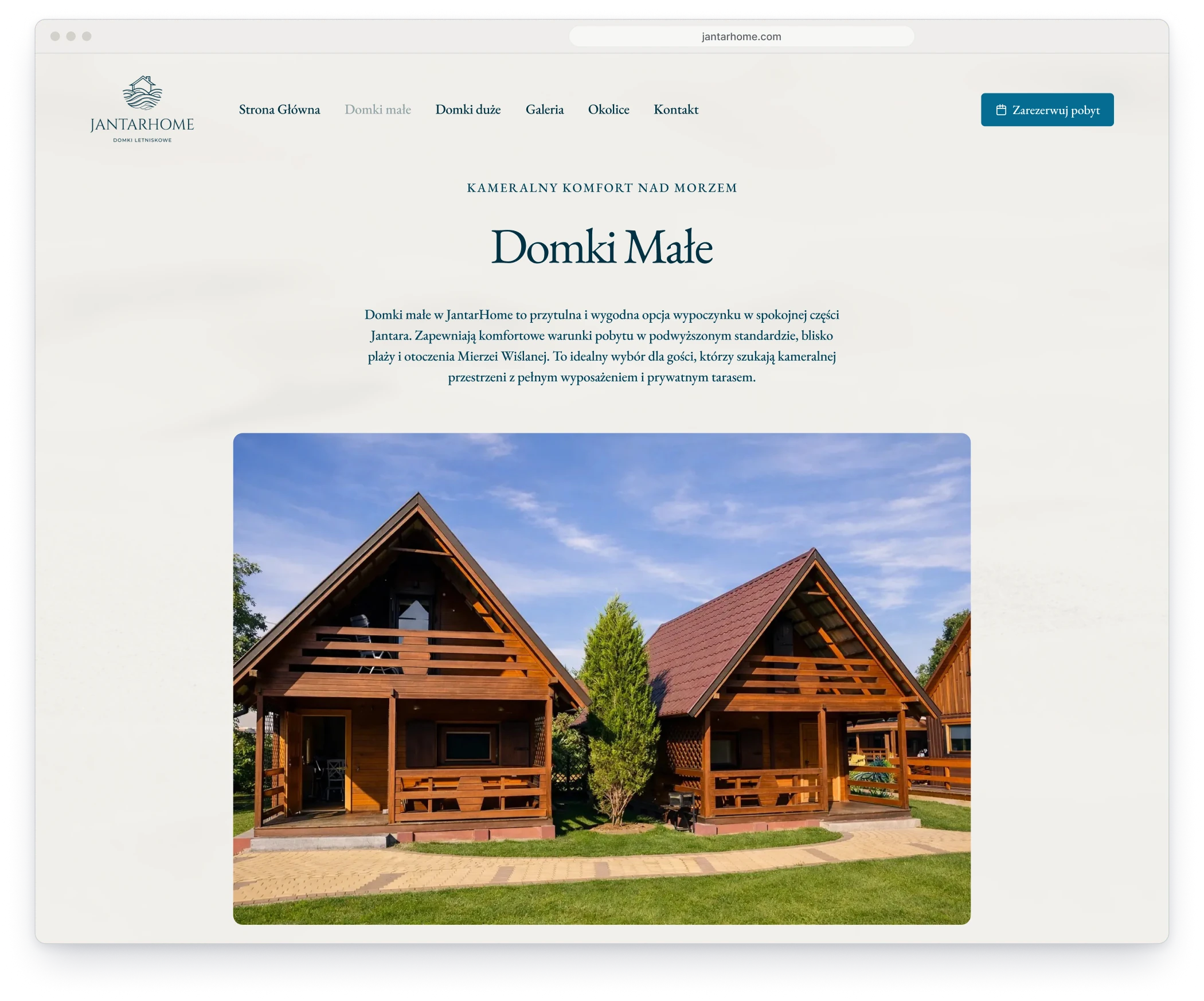 The page of the small cottages in a browser window, with the heading, a short description and a photograph of two wooden cottages with pointed roofs